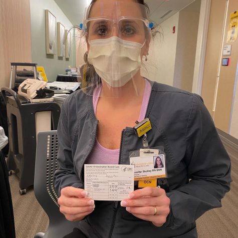 Jennifer Skelley pictured with her vaccine card. 