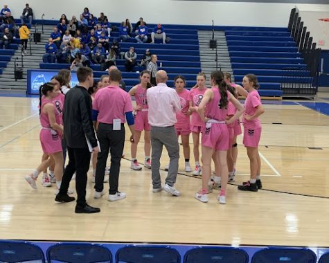 The girls get a pep talk from coach Sweeney during their game against Benton on January 27th