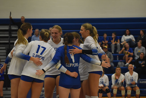 The girls volleyball team huddled at the October 20th game. Photo taken by the yearbook staff.
